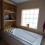 Enjoy this large soaker tub while relaxing at your cabin