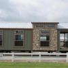 Tahoe Style Cabin with Exterior Rock Accents on display at Recreational Resort Cottages and Cabins in Rockwall, Texas