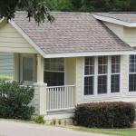 Recreational Park Model cottage with lap siding and craftsman style front porch available through Recreational Resort Cottages